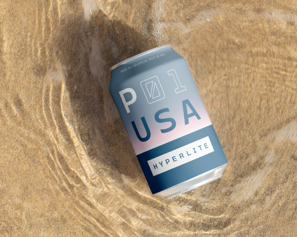 Closeup of a Hyperlite beer can label in shallow ocean water on sand