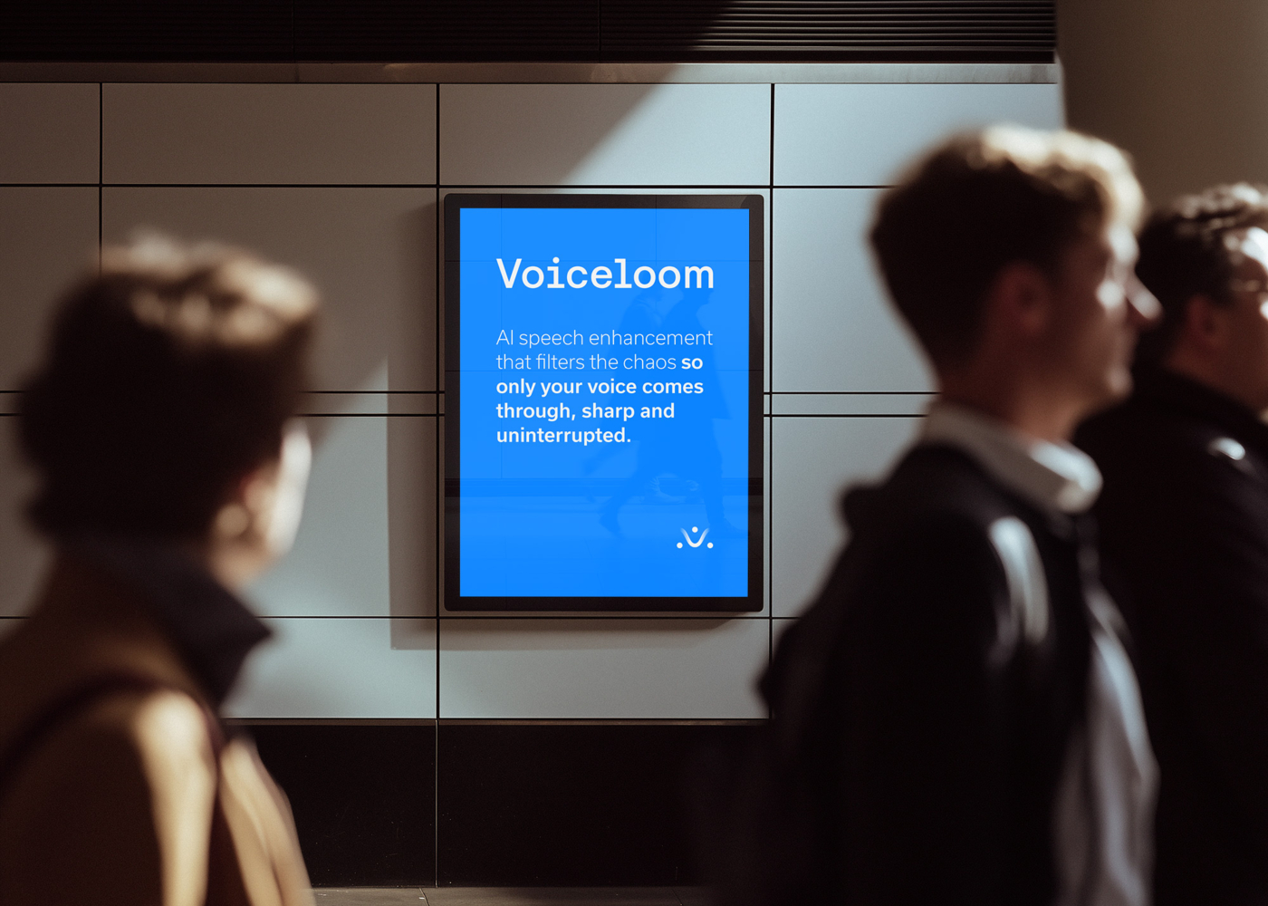 Voiceloom text advertisement in a busy airport corridor.
