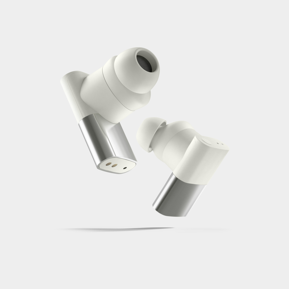Status Between 3ANC earbuds in bone on stark light gray background