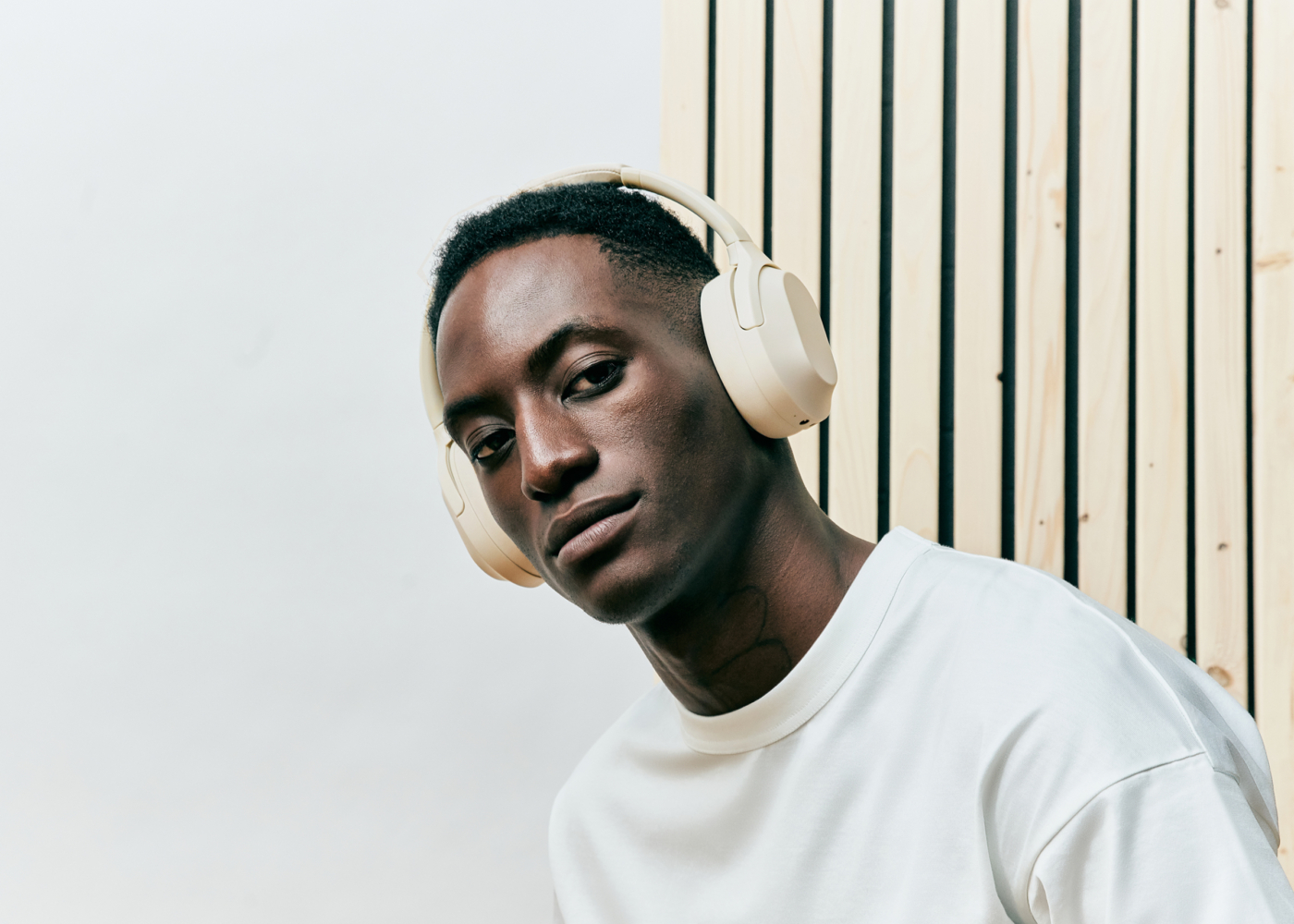 Model wearing Status Core ANC headphones