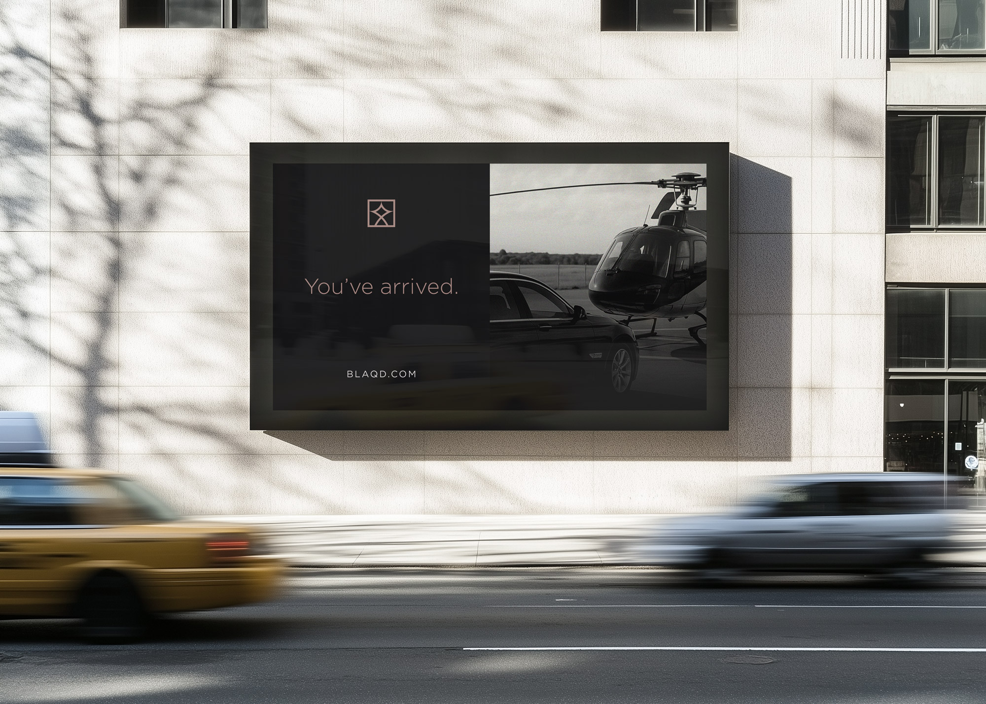 Billboard in urban environment showing elements fro the Blaqd visual identity.