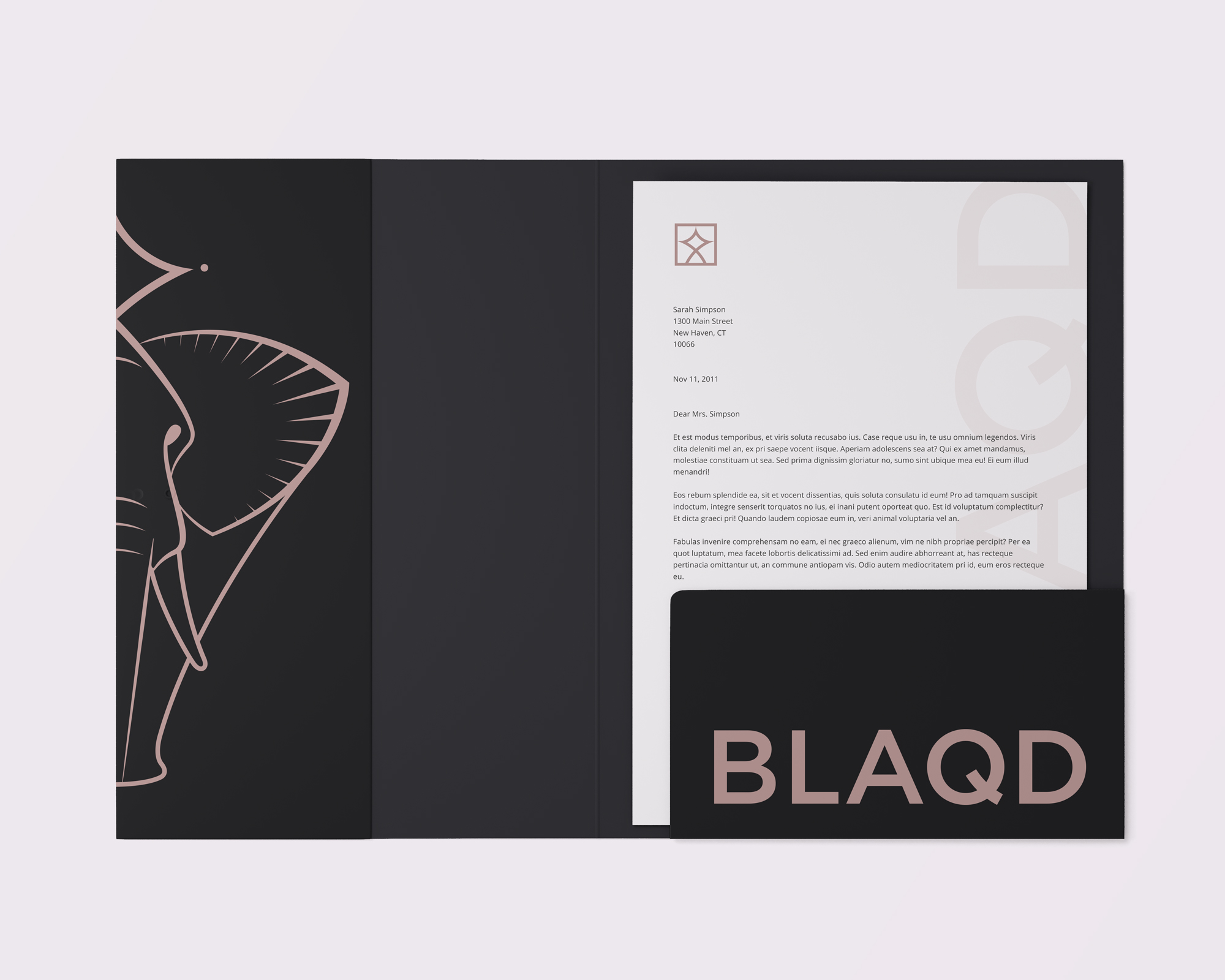 An open folder adorned with BLAQD branding and a BLAQD letter sample inside
