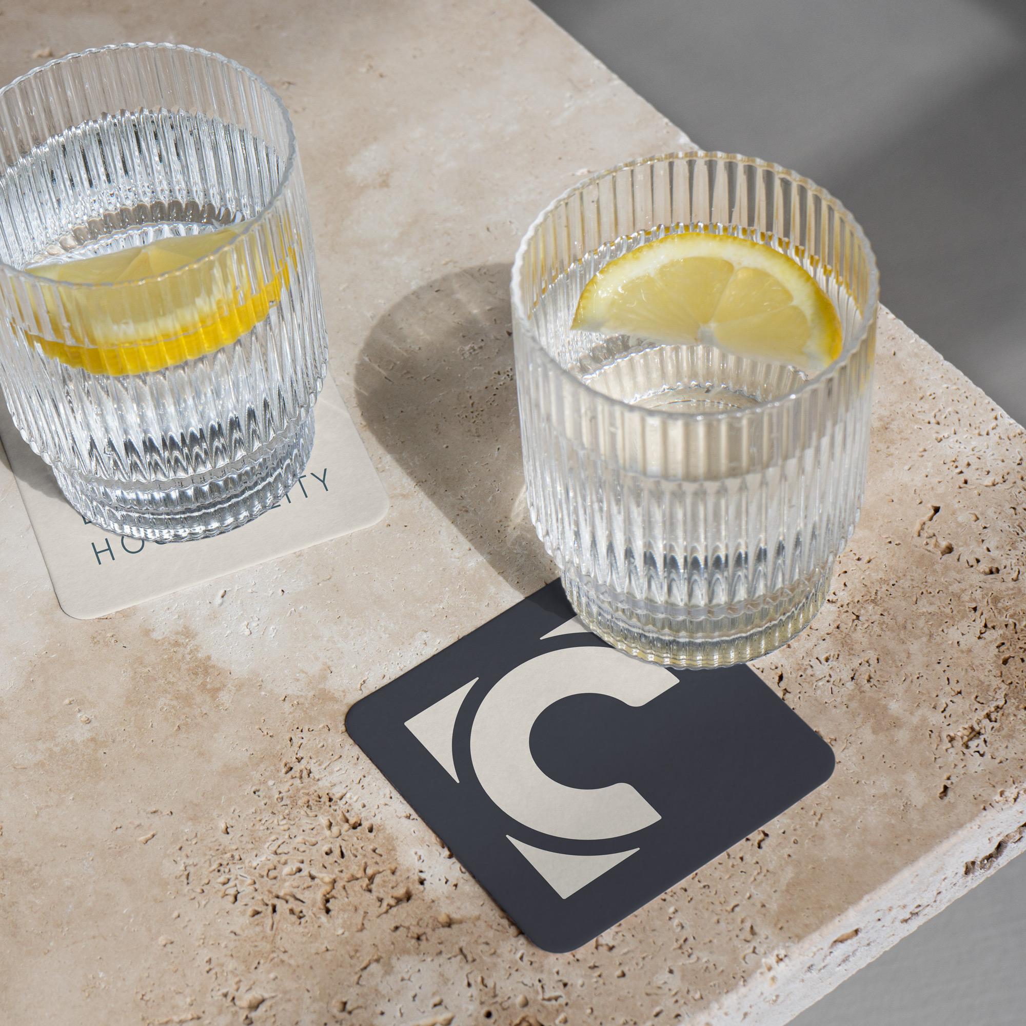 Corner Booth Hospitality logos on coasters