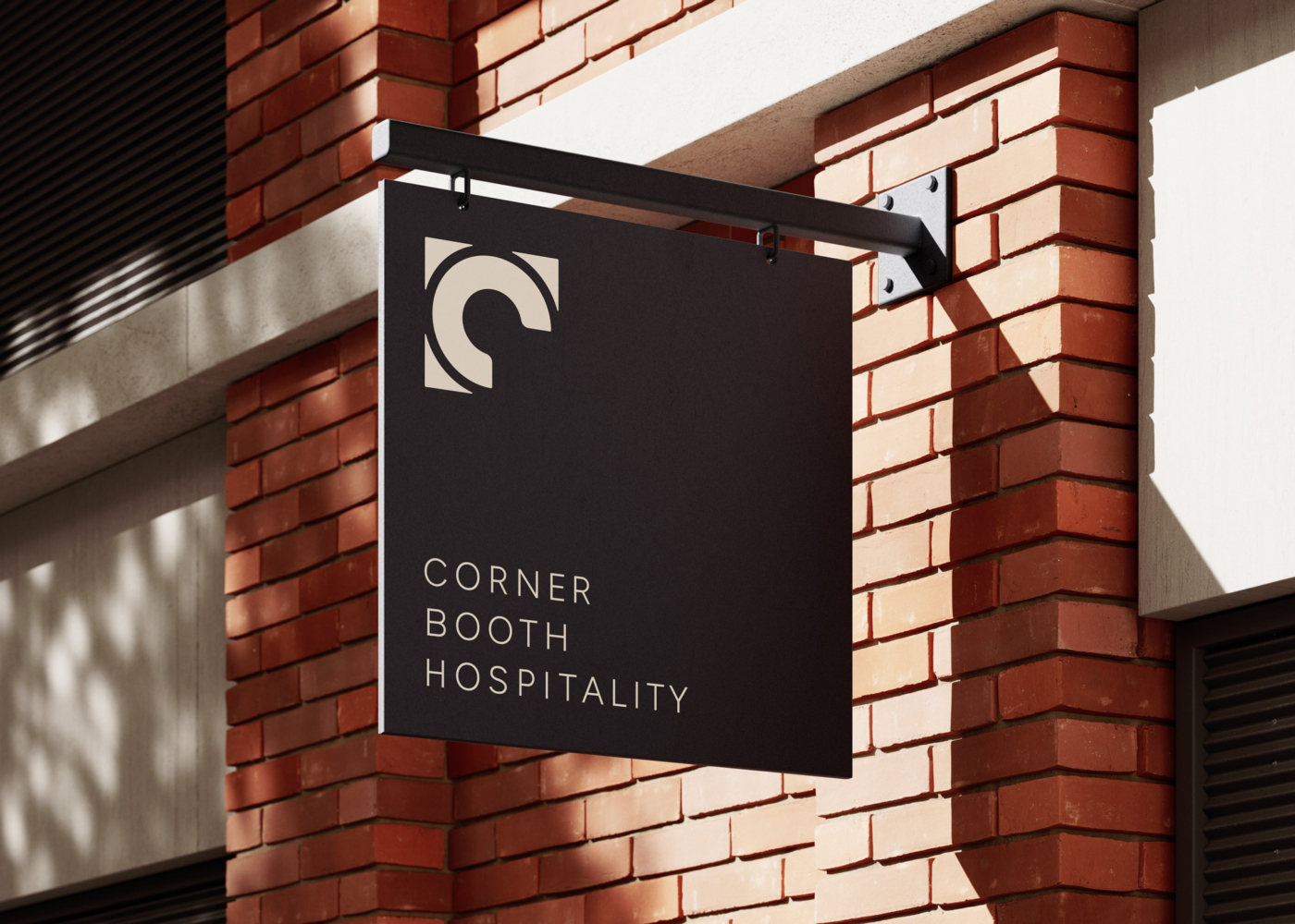 Corner Booth Hospitality logo treatment on a building's exterior signage