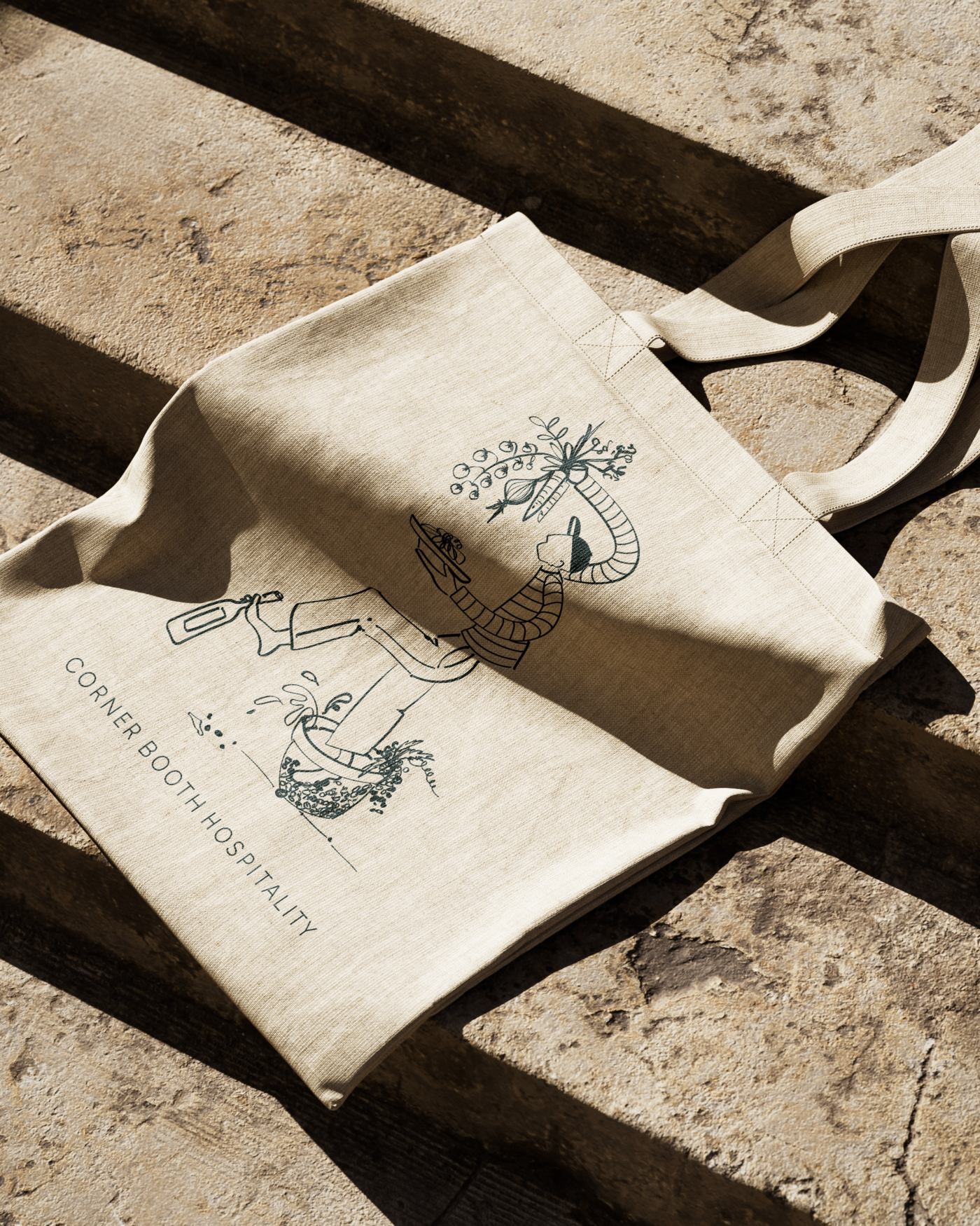 Corner Booth Hospitality illustrations by Molly Bloom on a branded tote bag