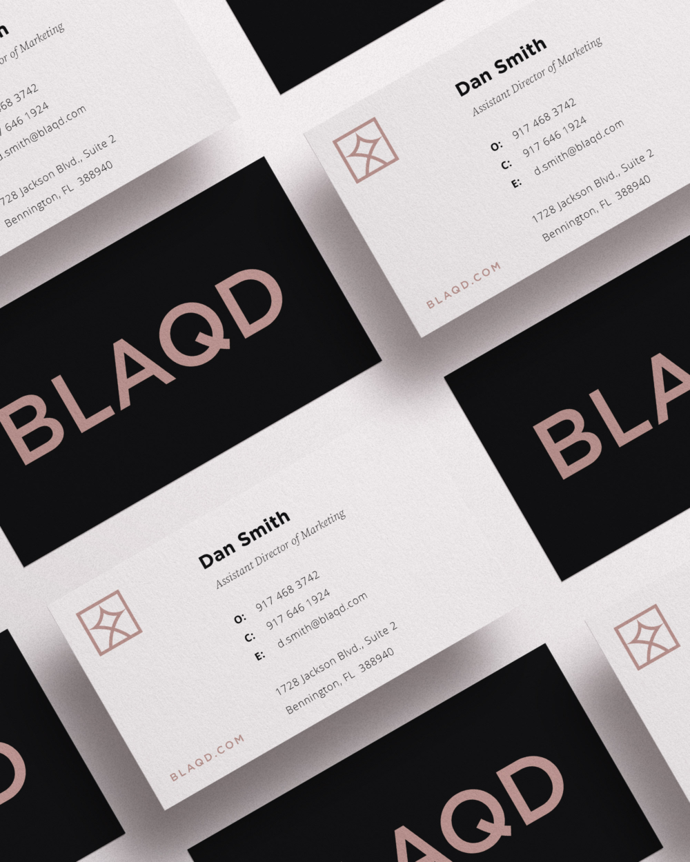 A grid of BLAQD business card fronts and back